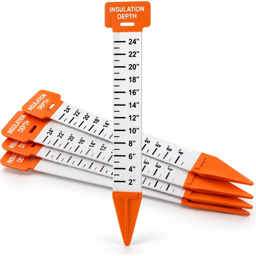 A set of orange and white insulation depth markers printed with inch measurements from 2" to 24"